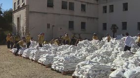 LA's fire zones prepare for incoming storm