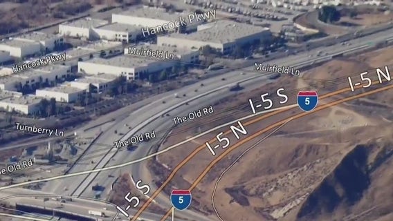 Hughes Fire shuts down major freeways