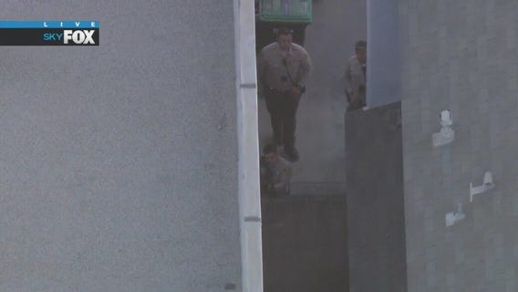 Pursuit suspect in standoff with police