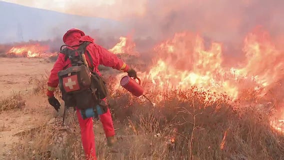 Inmate fire crews battle Hughes Fire