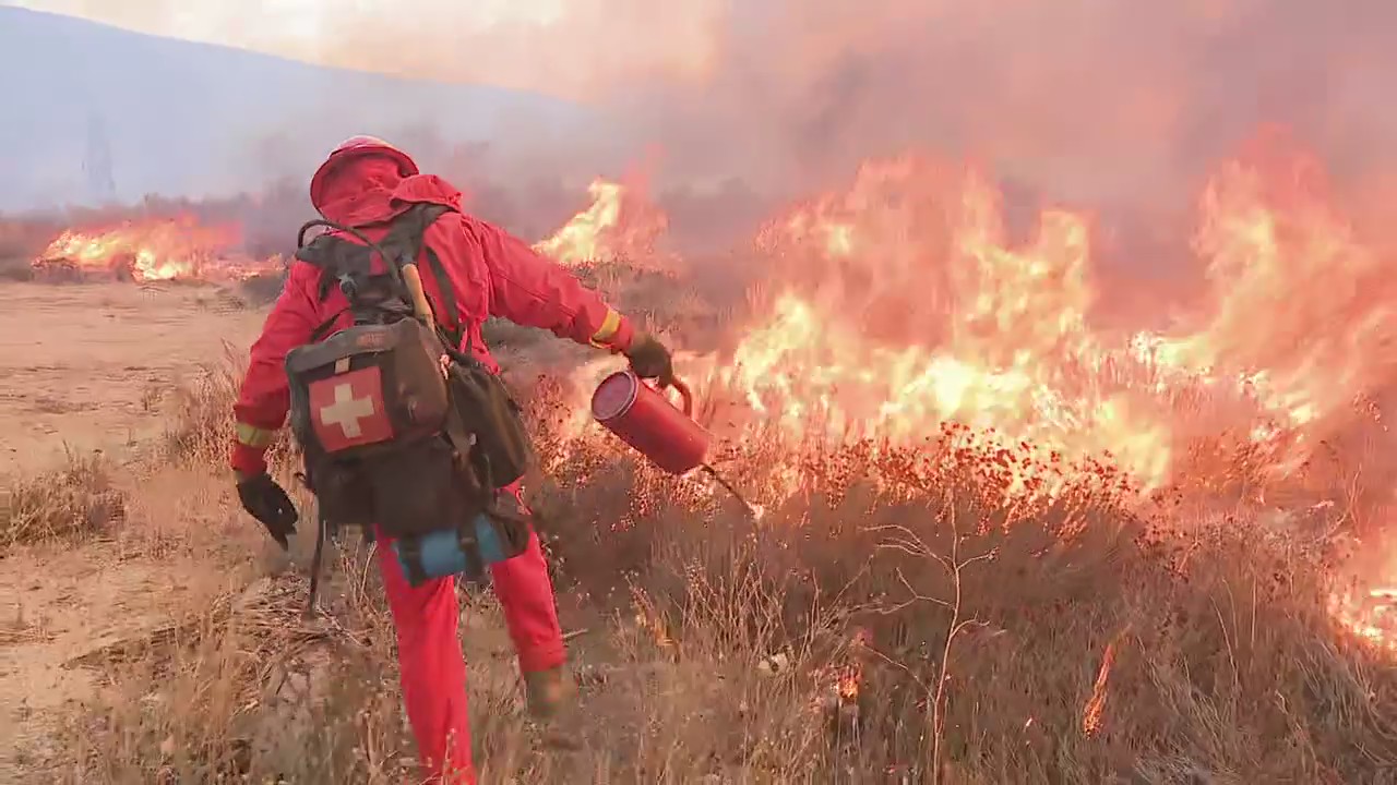 Inmate fire crews battle Hughes Fire