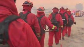 Inmate fire crews redirect flames to protect homes
