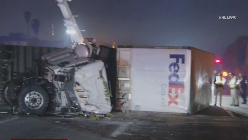 FedEx truck overturns on 60 Freeway