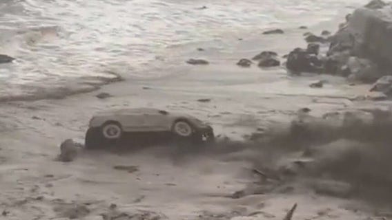 LA firefighter escapes car swept away in mudslide