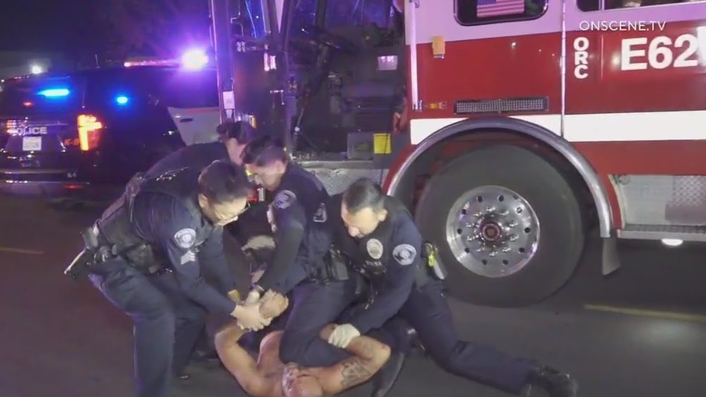 Man attacks firefighters, locks himself in firetruck