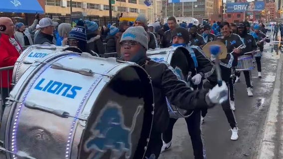 Honolulu Boom performs outside of Ford Field as fans enter for Divisional playoff game