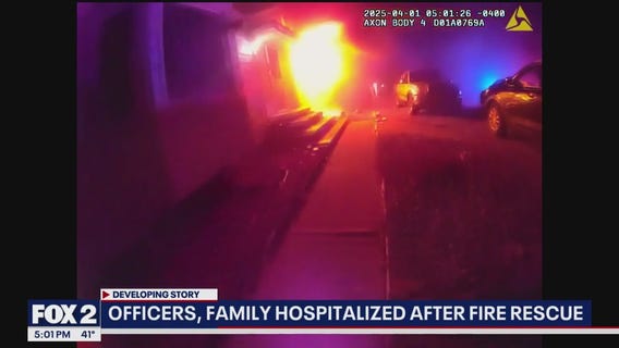 Farmington Hills police rush in to save 8 from burning home