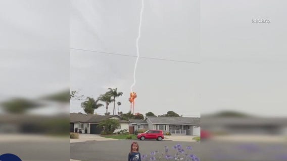 Lightning strike behind little girl