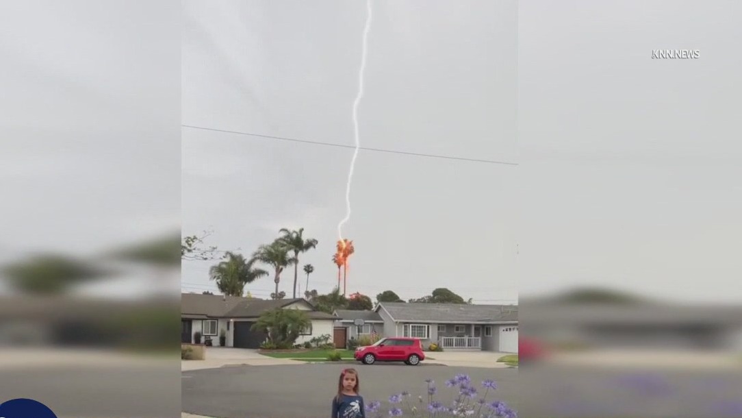 Lightning strike behind little girl