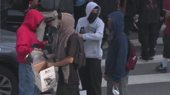 Alleged agitators hand out face shields in LA
