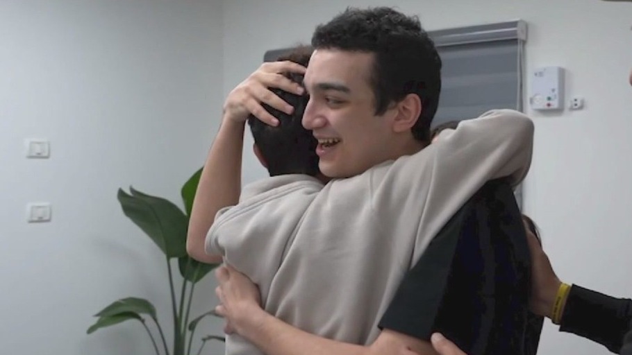 Freed Hamas hostage reunites with family