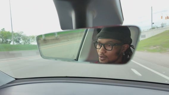 Instructor captures two people passing liquor between cars on I-94