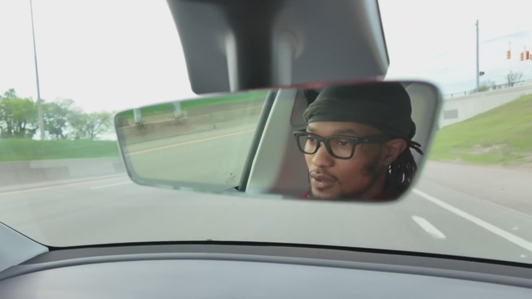 Instructor captures two people passing liquor between cars on I-94