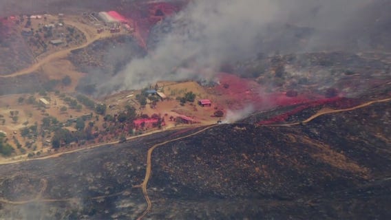Juniper Fire burns near barns in Perris