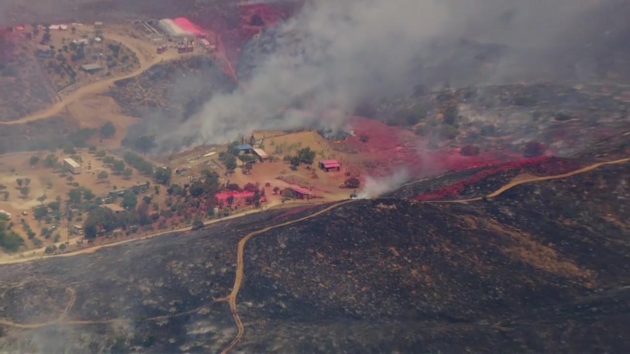 Juniper Fire burns near barns in Perris
