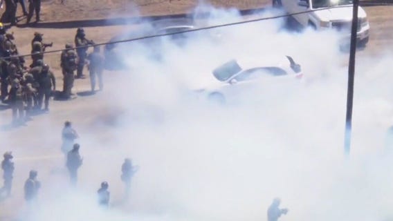 Standoff between federal agents, ICE protesters