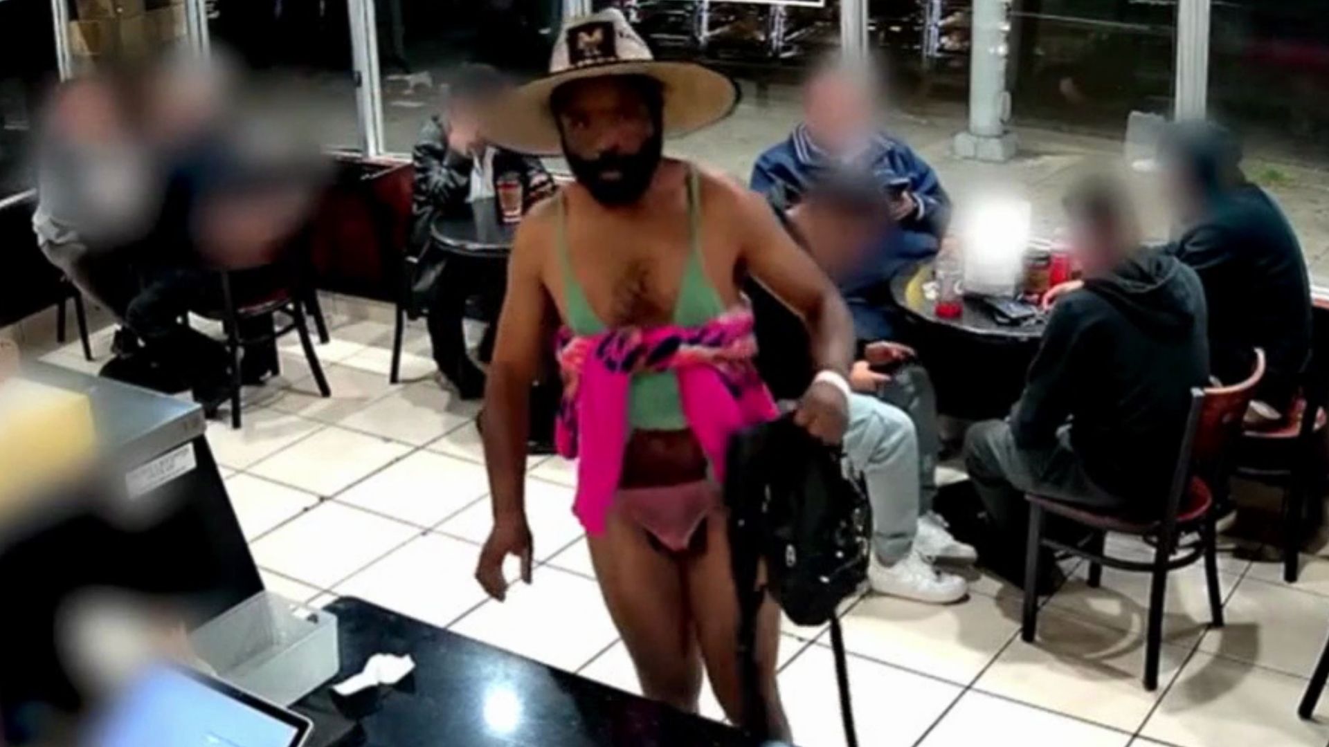 Man in bikini robs donut shot; Workers fight back