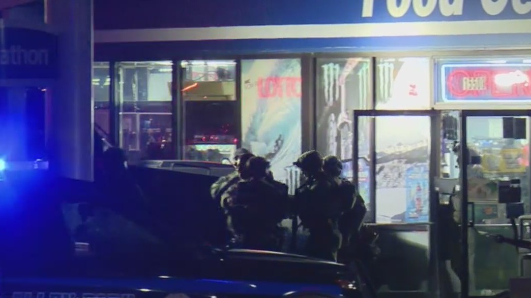 Knife-wielding man arrested after gas station standoff