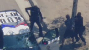 Pursuit suspect throws punch at LAPD officer