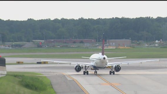 Passenger tries opening door of Detroit-bound flight while mid-air