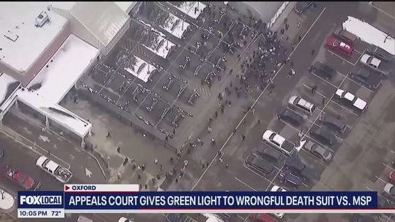 Melvindale officer remembered, Oxford parent allowed to sue , the weather and more