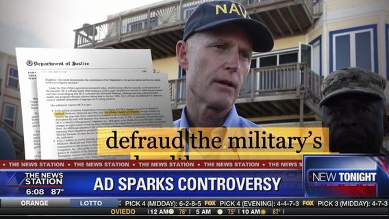 Ad targets Rick Scott's Navy hat