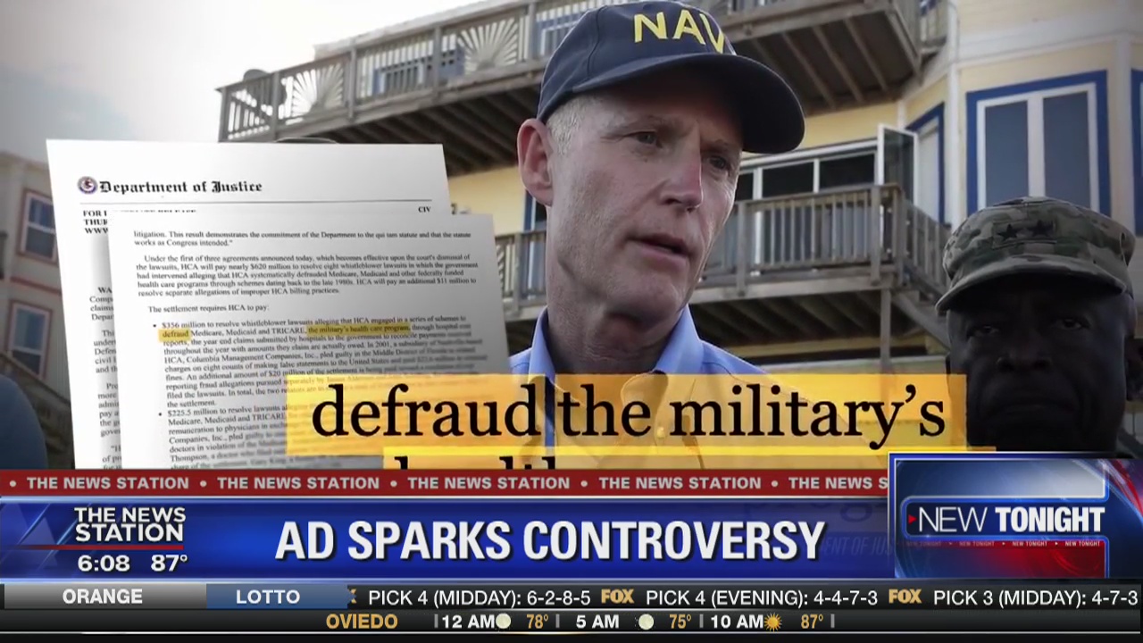 Ad targets Rick Scott's Navy hat
