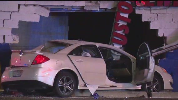 Driver in custody after crashing into building killing 2