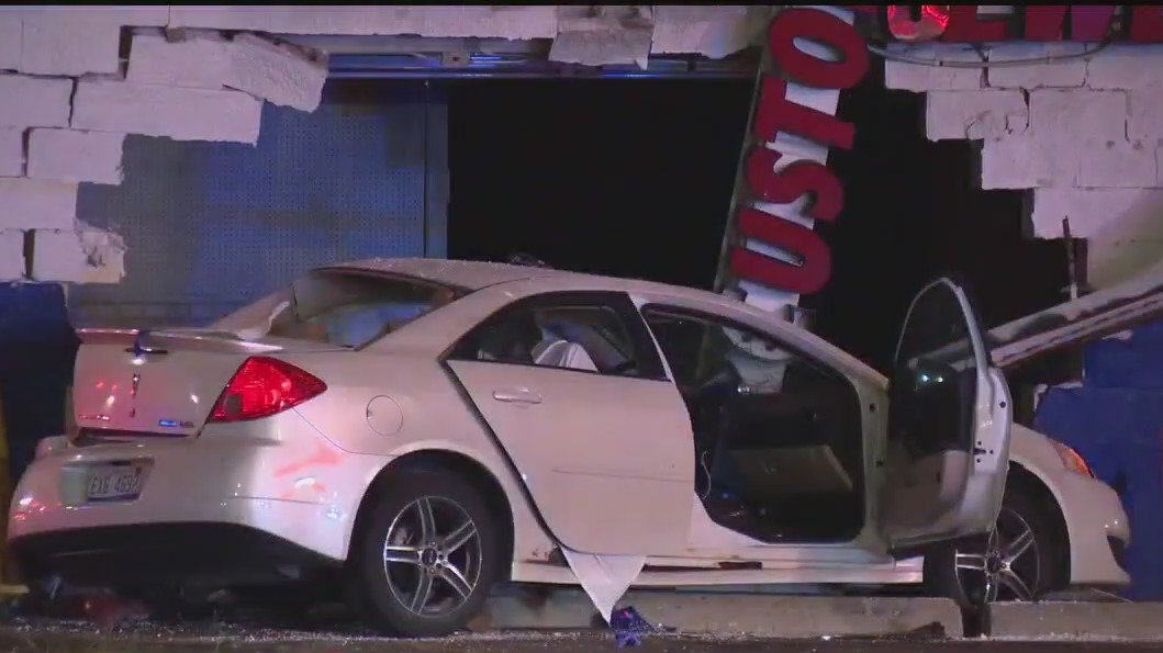 Driver in custody after crashing into building killing 2