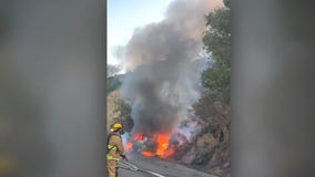Car fire sparks Hollywood Hills brusher