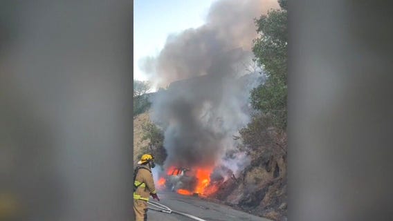 Car fire sparks Hollywood Hills brusher
