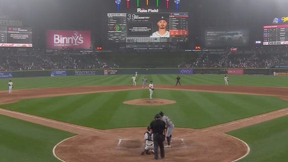 What sparked rain delay during Tigers game?