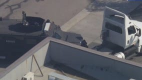 SWAT car clashes with stolen big rig mid-pursuit