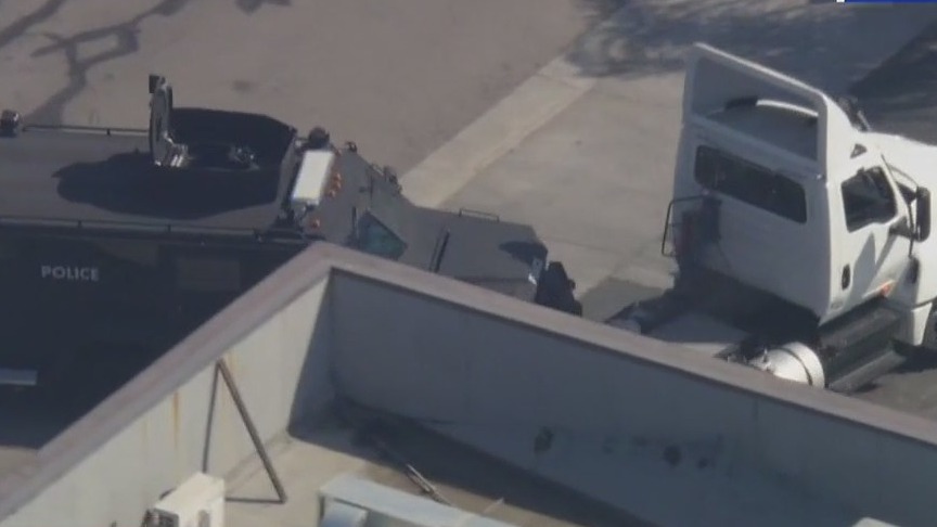SWAT car clashes with stolen big rig mid-pursuit