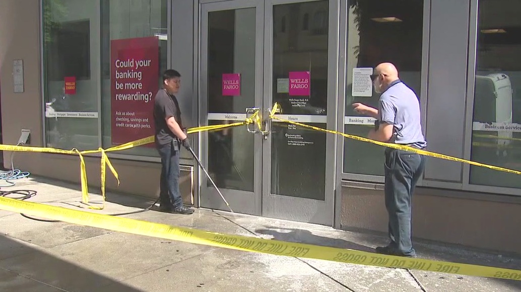 Bottles of resin found taped to doors of bank