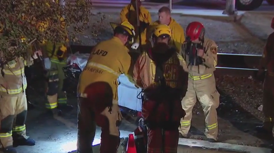 LA firefighters rescue woman from manhole
