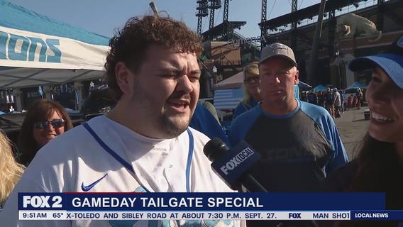 Dave Fio, American Idol contestant,  belts out the National Anthem at Lions tailgate