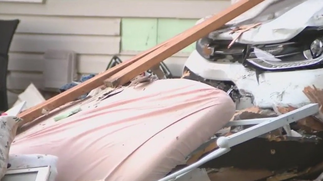 Child thrown from bed when SUV crashes through house