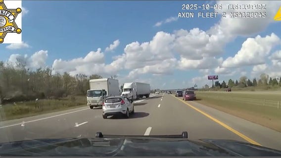 Armed domestic violence suspect police chase on I-96