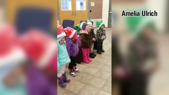 Kid carolers spread Christmas cheer in Hugo
