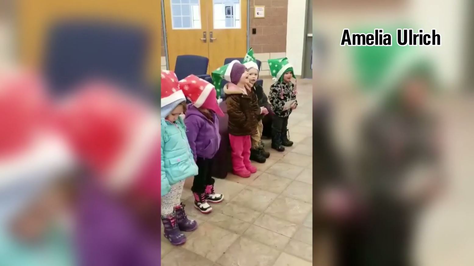 Kid carolers spread Christmas cheer in Hugo