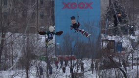 Eagles and Patriots mascots race on zipline