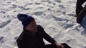 Fox 9 photographer helps Roger Goodell up after fall at Super Bowl event