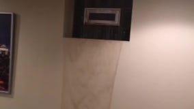 Waterfall in basement during record Minnesota rainfall