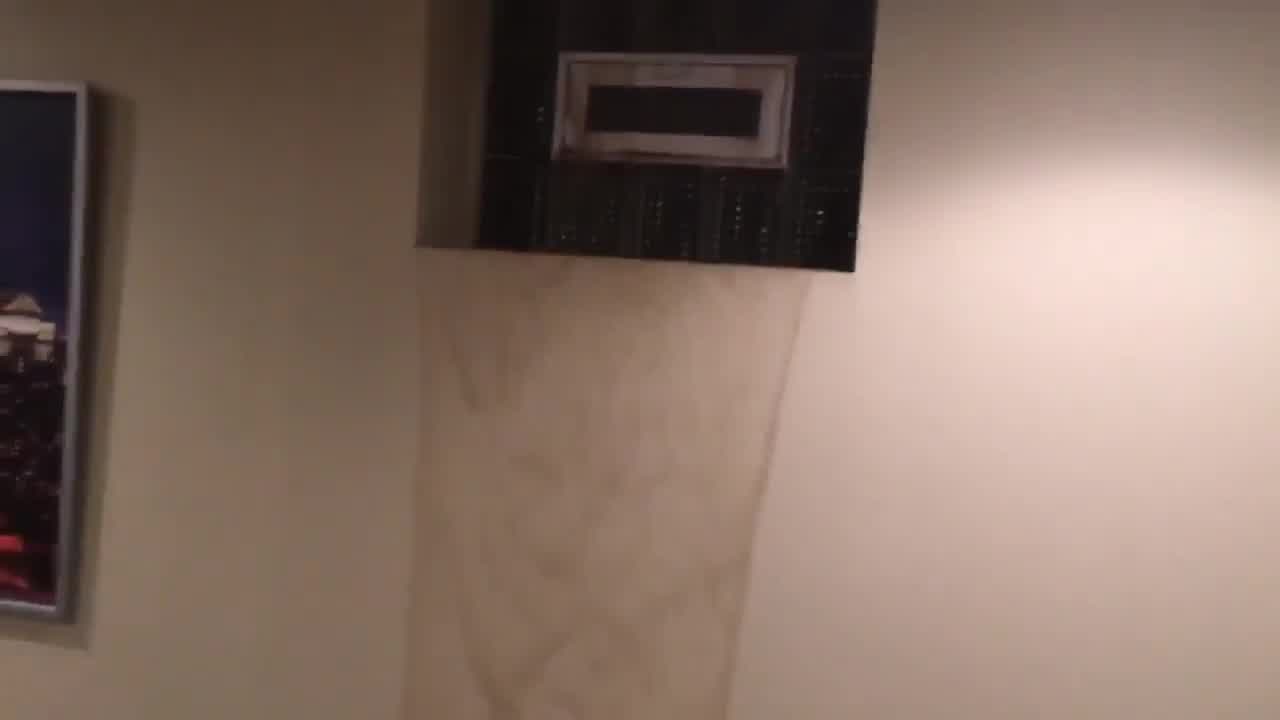 Waterfall in basement during record Minnesota rainfall