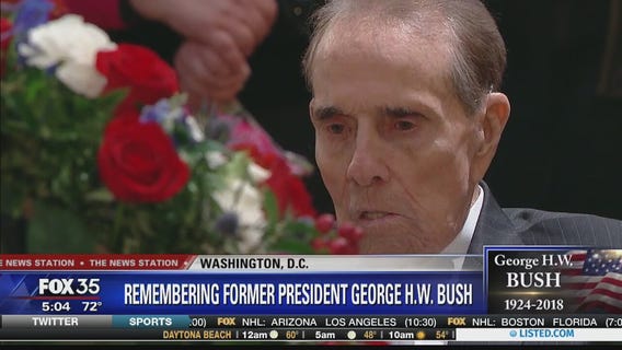 Bob Dole visits Capitol Rotunda to pay respects to George HW Bush