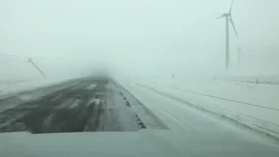 Power lines snap in strong winds on Highway 86 in southwestern Minnesota