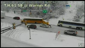 Buses, car stuck on icy U.S. Highway 61 hill in St. Paul