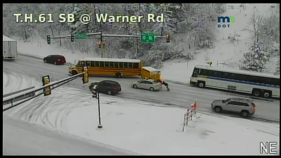 Buses, car stuck on icy U.S. Highway 61 hill in St. Paul