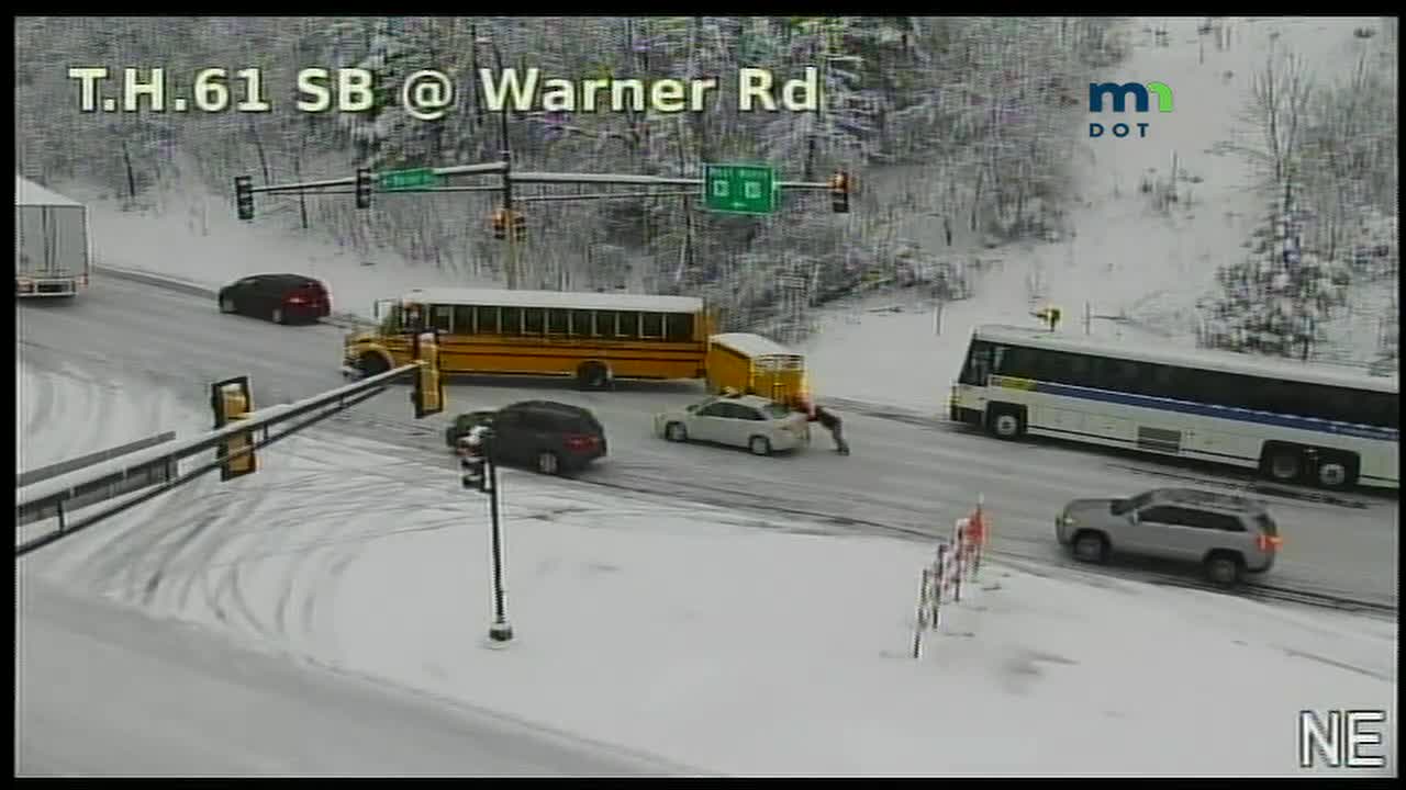 Buses, car stuck on icy U.S. Highway 61 hill in St. Paul